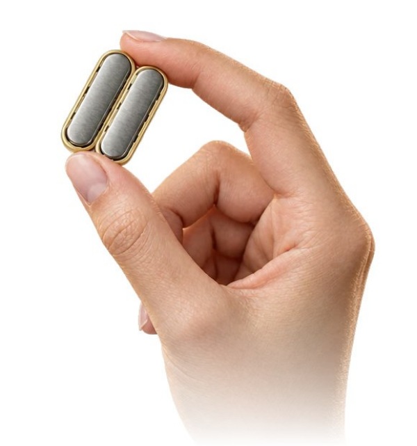 The two MagDI magnets held between finger and thumb